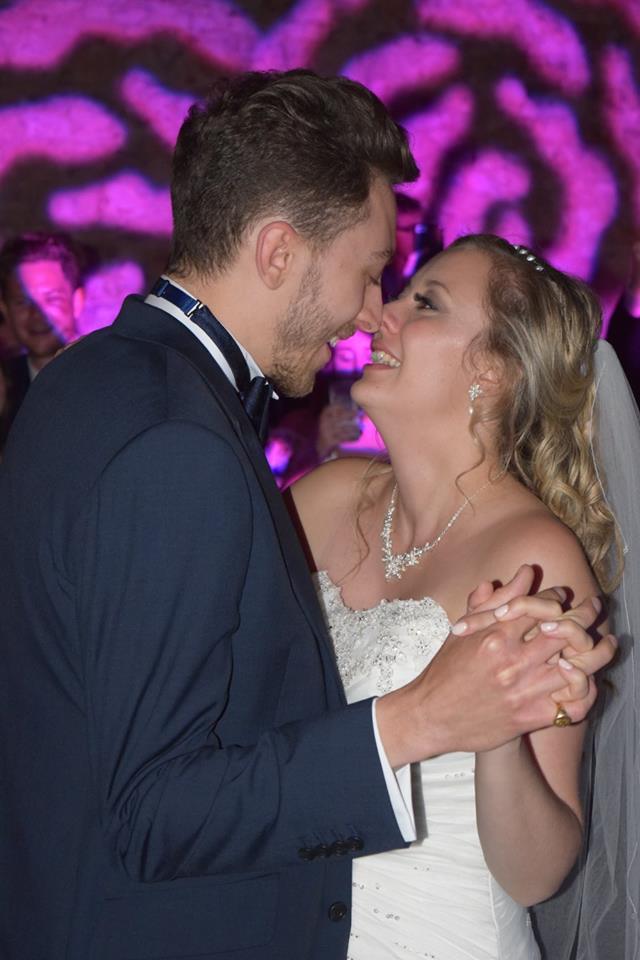 happy couple sharing a first dance kiss