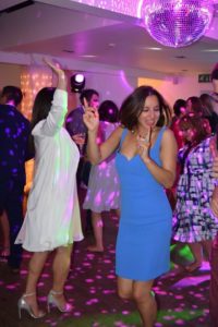 Guests dancing to 80s pop classics at a wedding in Hertfordshire