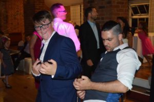 Guests dancing to 90s pop classics DJ music at Essex party