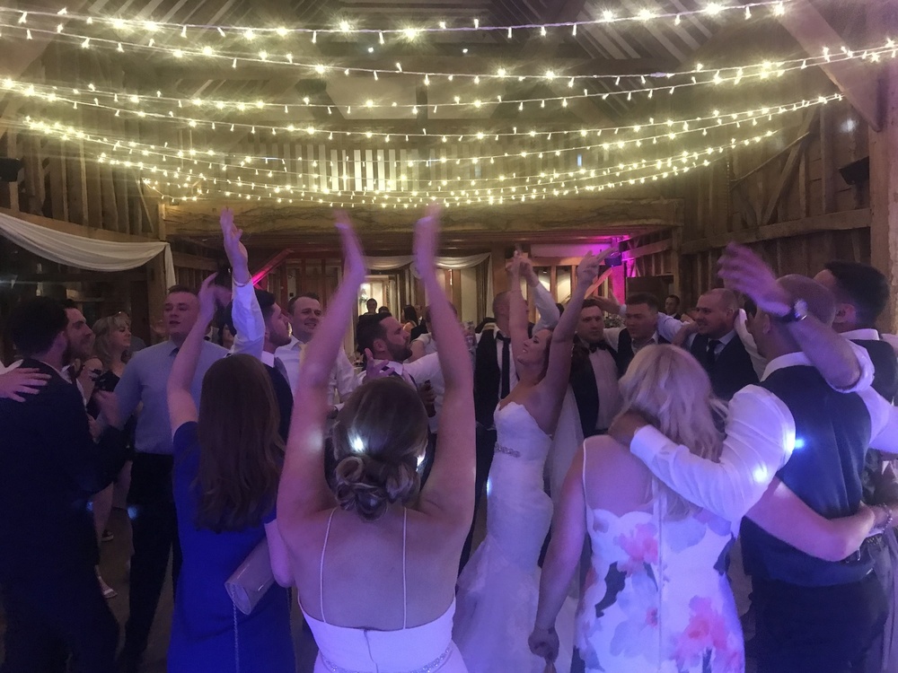 Wedding dancefloor in full swing at Tewinbury Farm, Hertfordshire with Herts Events DJ