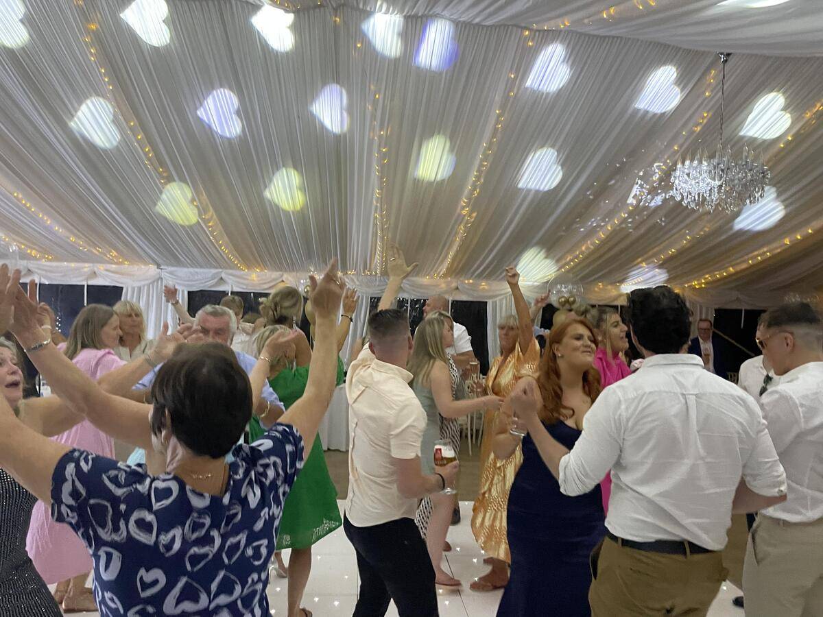 Dancefloor glowing with evening party lighting