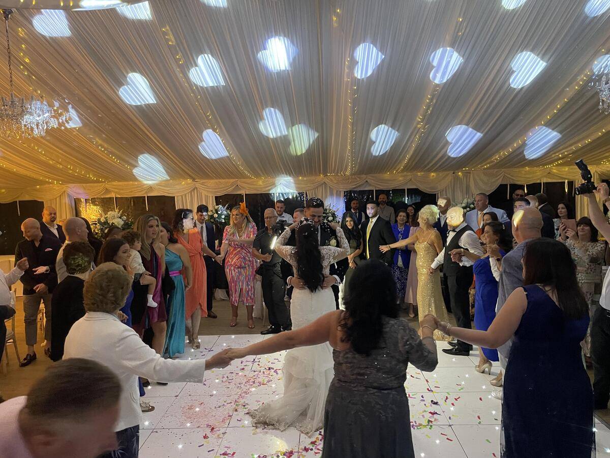 Love heart Lighting as bride and groom embrace