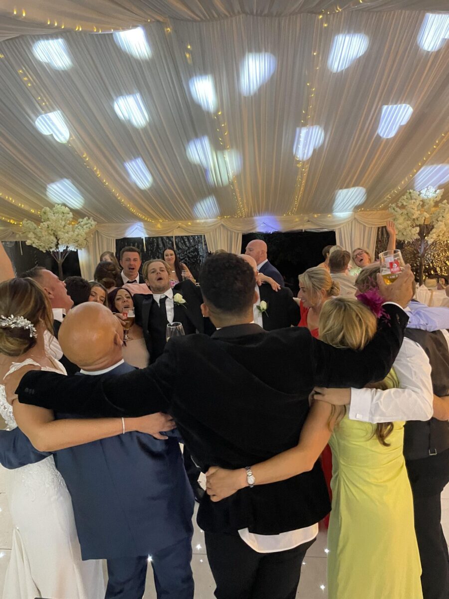 Guests celebrating on the wedding dancefloor