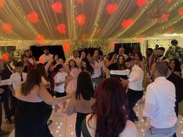 Andy, a wedding DJ in Hertfordshire, DJing at a wedding celebratio