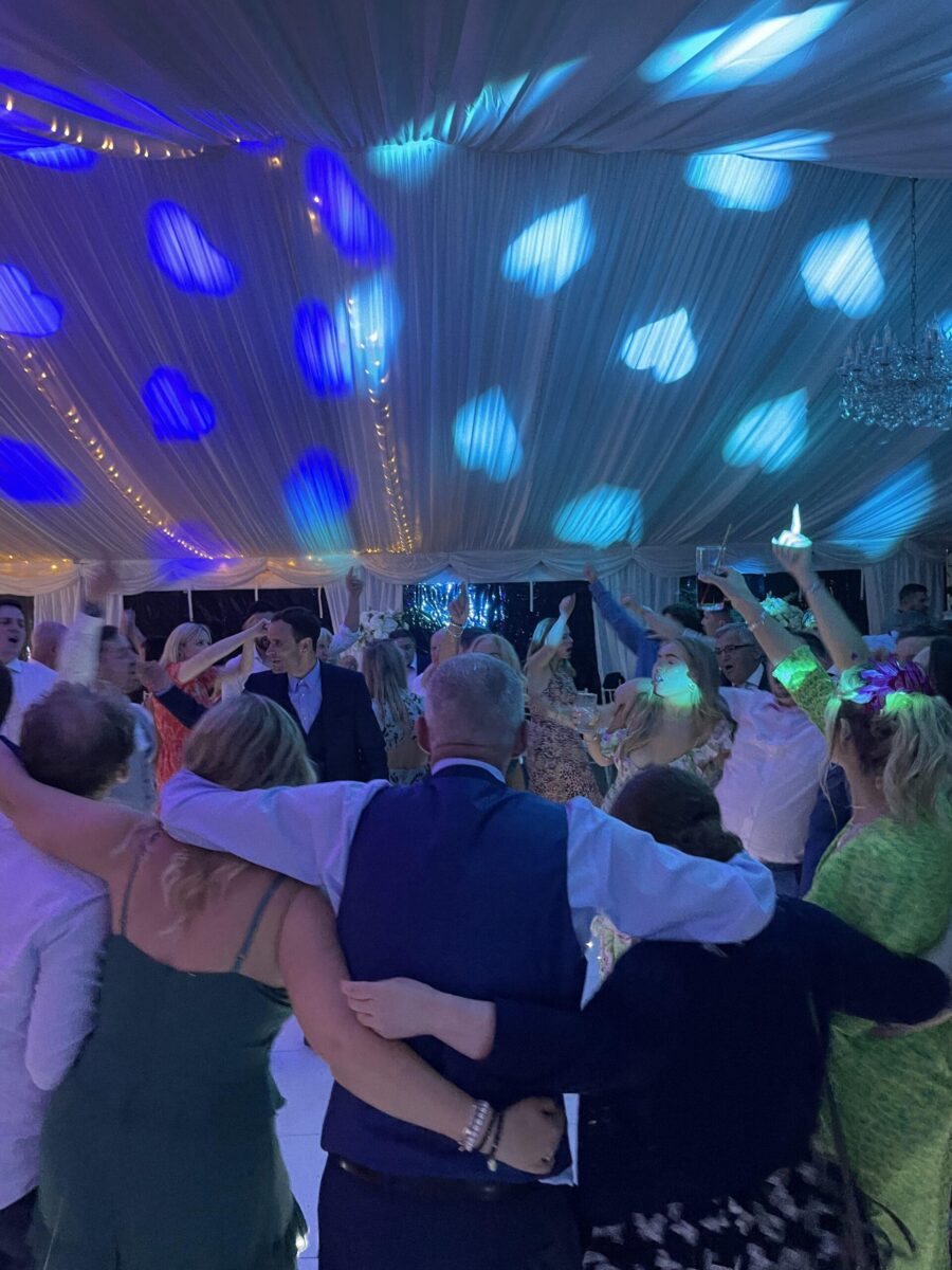 guests dancing under blue lighting