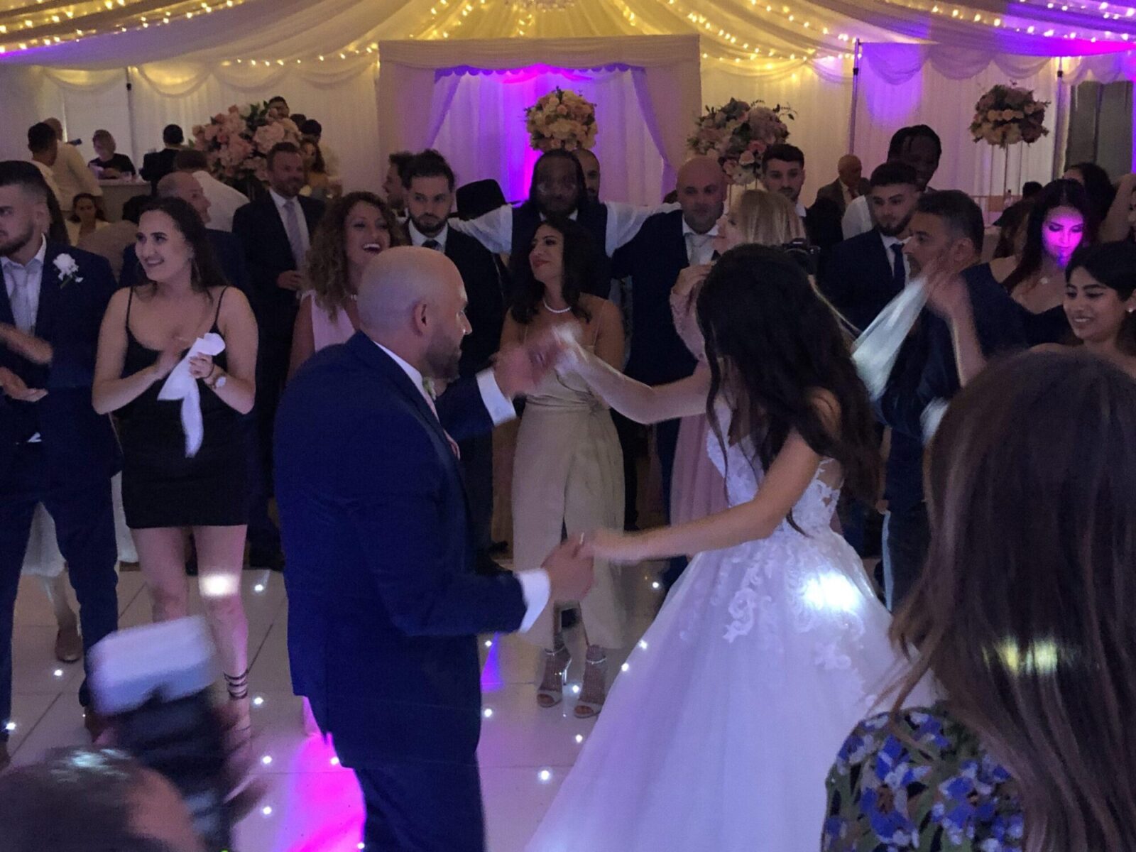 Guests celebrating the newlyweds with dancing