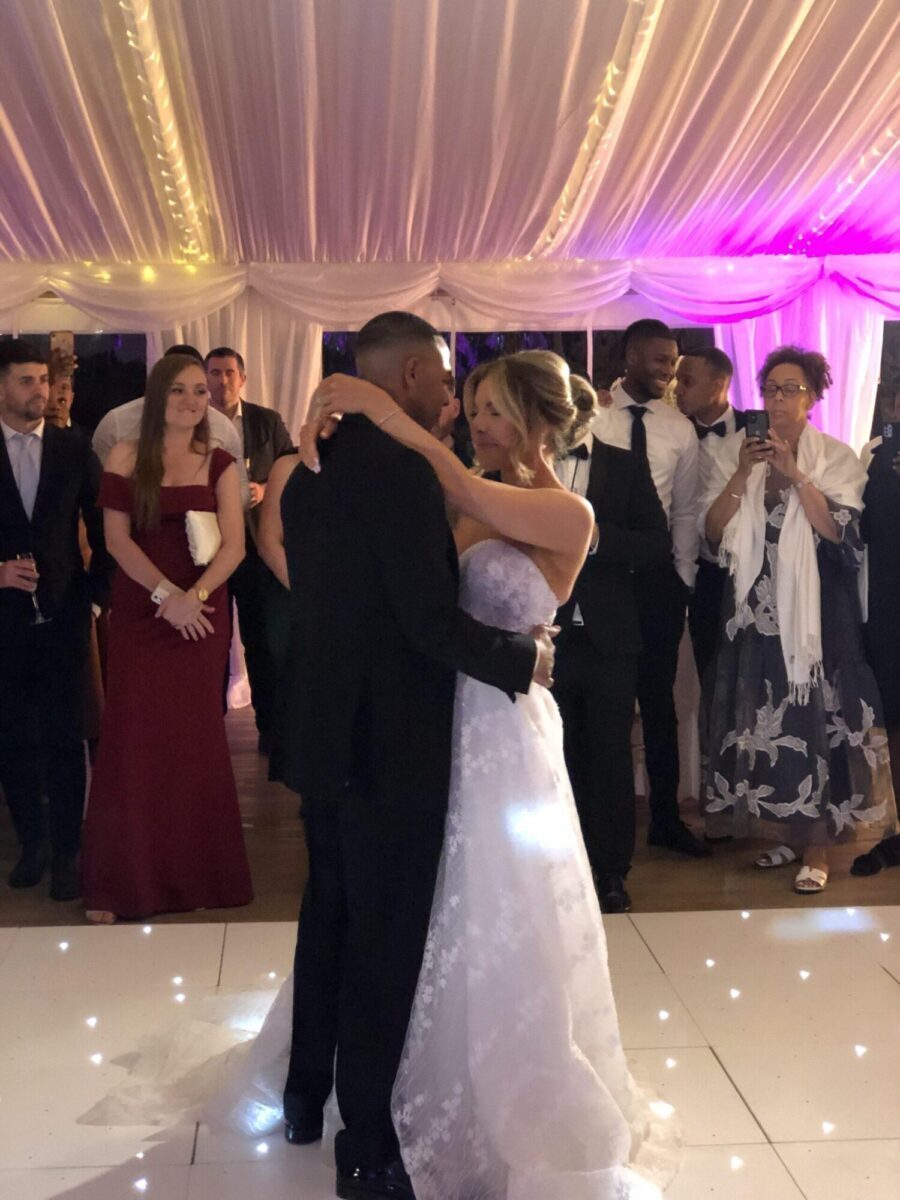 Newlyweds smiling and dancing together