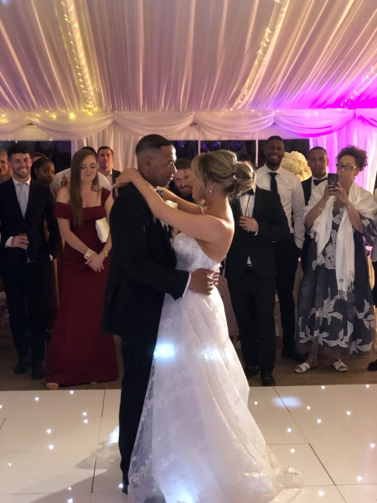 Newlyweds smiling and dancing togethe