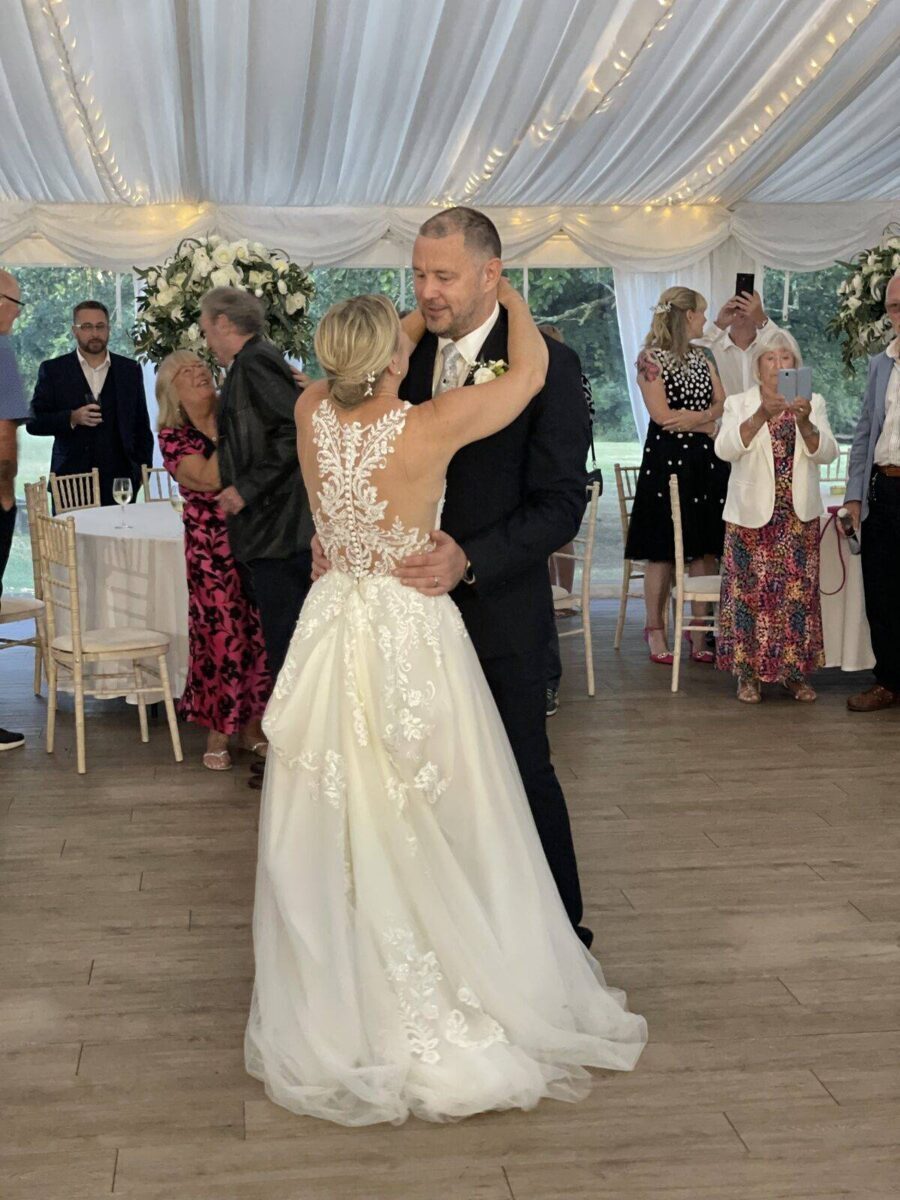 Guests singing along while the DJ mixes