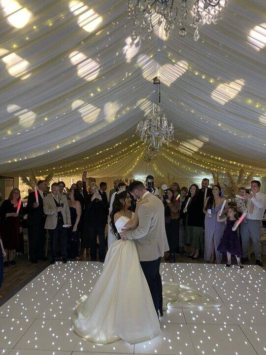 Bride and groom first dance at Mulberry House with DJ lighting