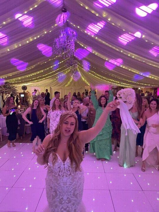 Bride throwing bouquet during wedding reception at Mulberry House, Essex – Herts Events Wedding DJ