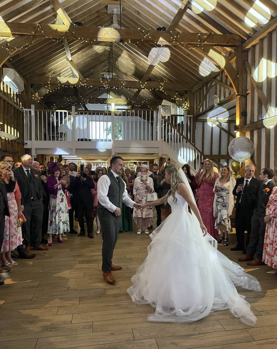 Couple enjoying a fun, lively first dance with Milling Barn Wedding DJ