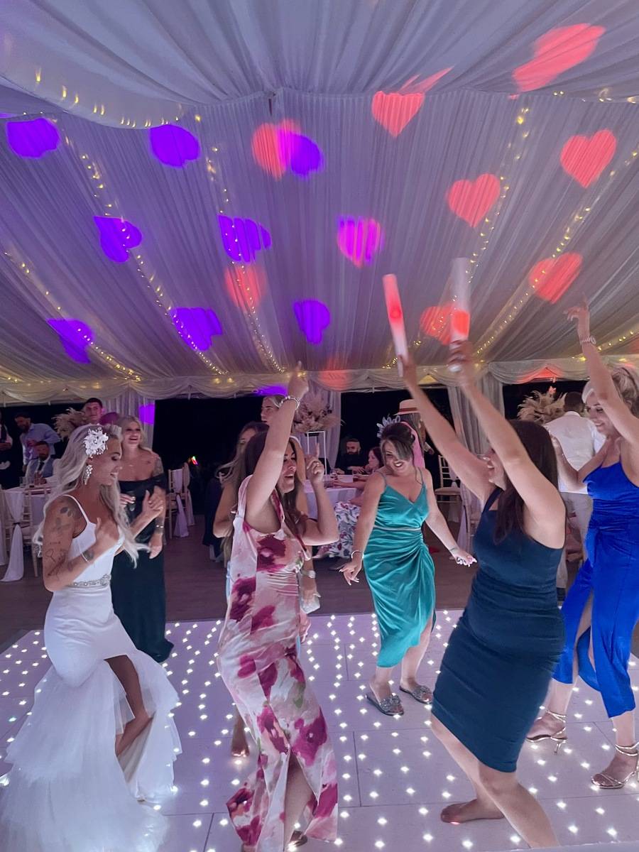 Bride and Bridesmaids having fun on the dancefloor